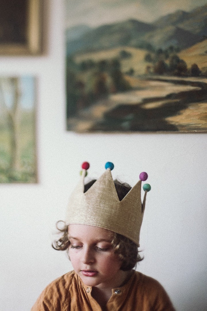 Jude in pom pom crown